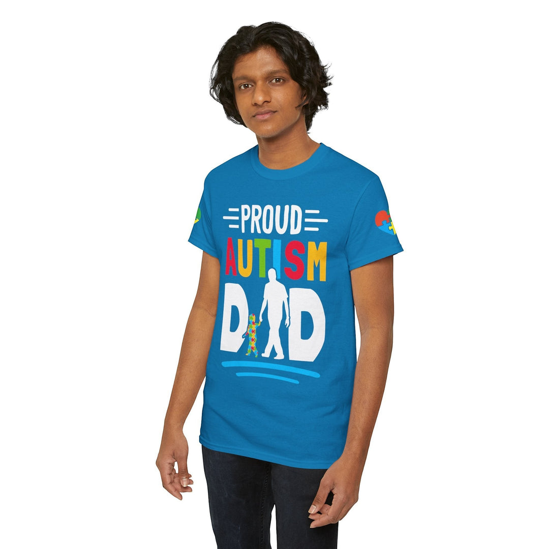 Sea Dragon Dreams blue heavy cotton t-shirt with Proud Autism Dad graphic print worn by a young man.