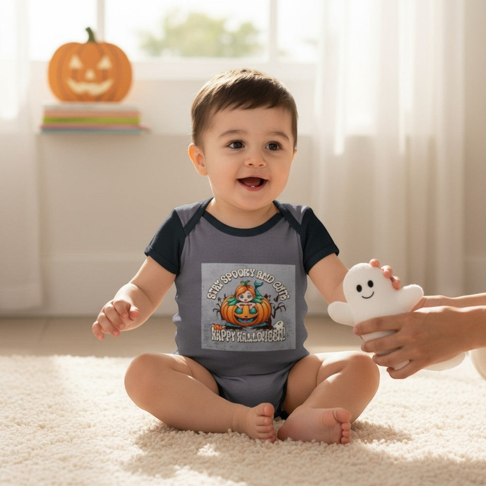 Sea Dragon Dreams infant bodysuit with Stay Spooky and Cute pumpkin graphic, worn by a baby playing with a ghost toy
