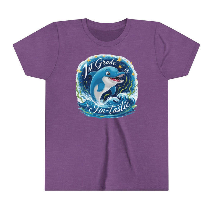 Sea Dragon Dreams purple youth t-shirt with a 1st Grade Fintastic dolphin graphic and crew neckline.