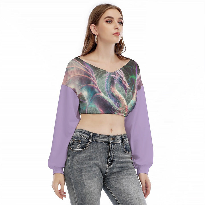 Sea Dragon Dreams purple cropped long-sleeve V-neck sweatshirt featuring a mystical dragon print on the chest