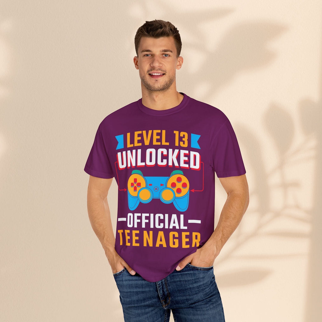 Sea Dragon Dreams purple unisex gamer t-shirt with Level 13 Unlocked Official Teenager graphic and game controller print.