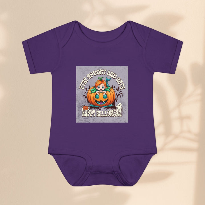 Sea Dragon Dreams infant bodysuit in purple cotton with a Stay Spooky and Cute pumpkin Halloween graphic print.