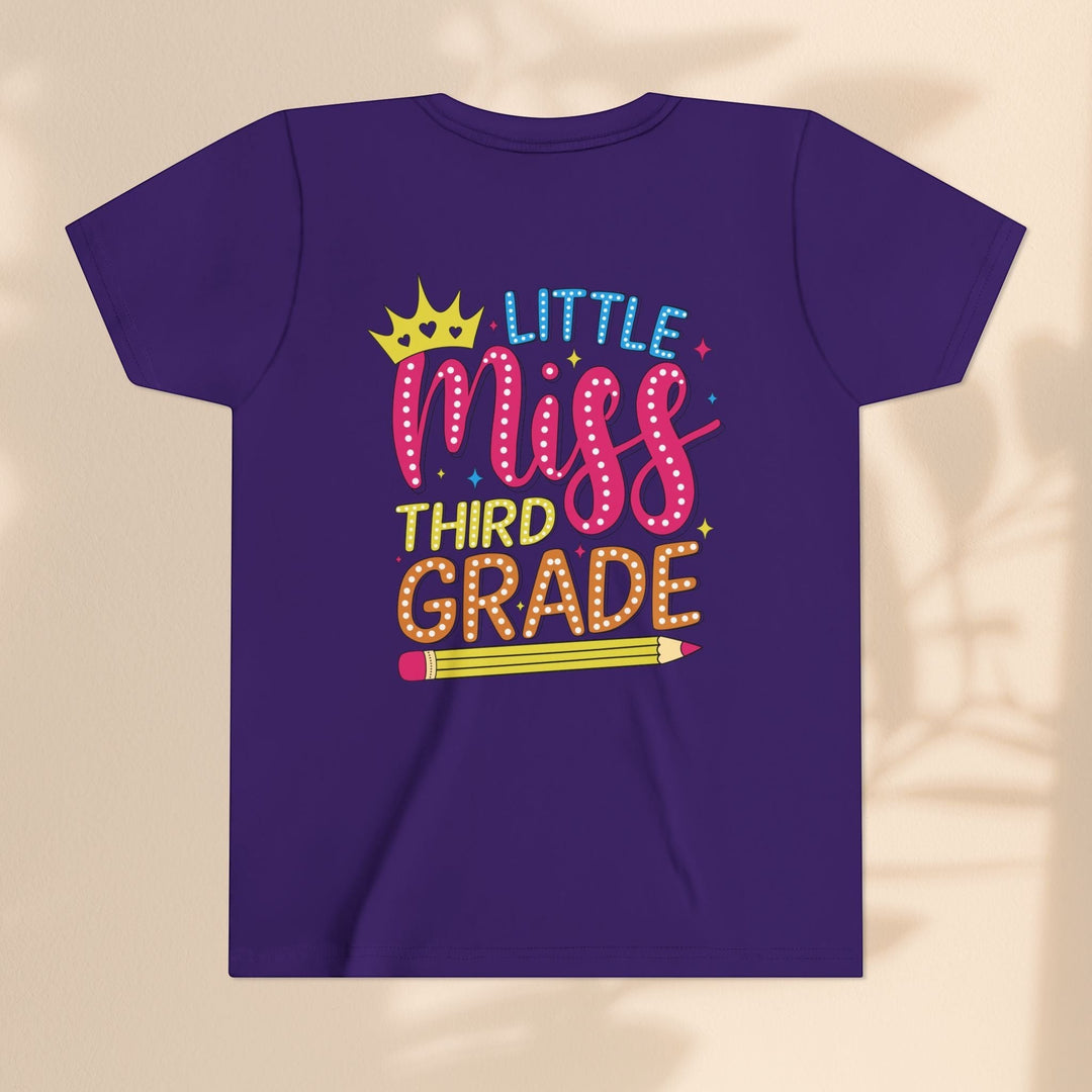 Sea Dragon Dreams purple youth t-shirt with Little Miss Third Grade graphic featuring a crown and pencil design.