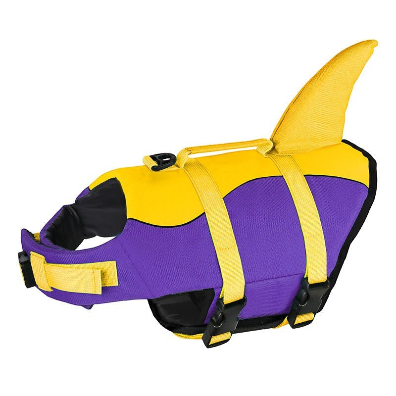 Sea Dragon Dreams purple and yellow dog life jacket with a shark fin and rescue handle on a white background