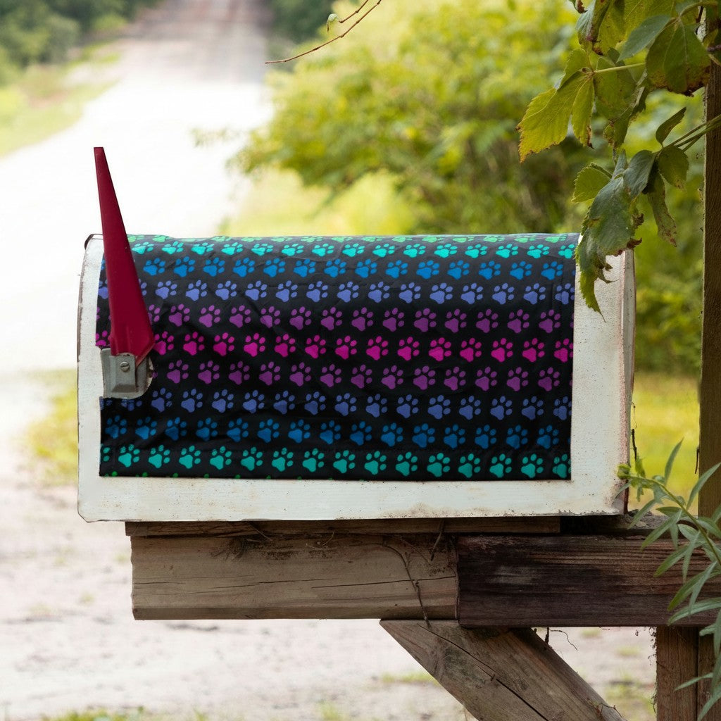Sea Dragon Dreams magnetic mailbox cover featuring a vibrant rainbow paw print pattern on a black background.