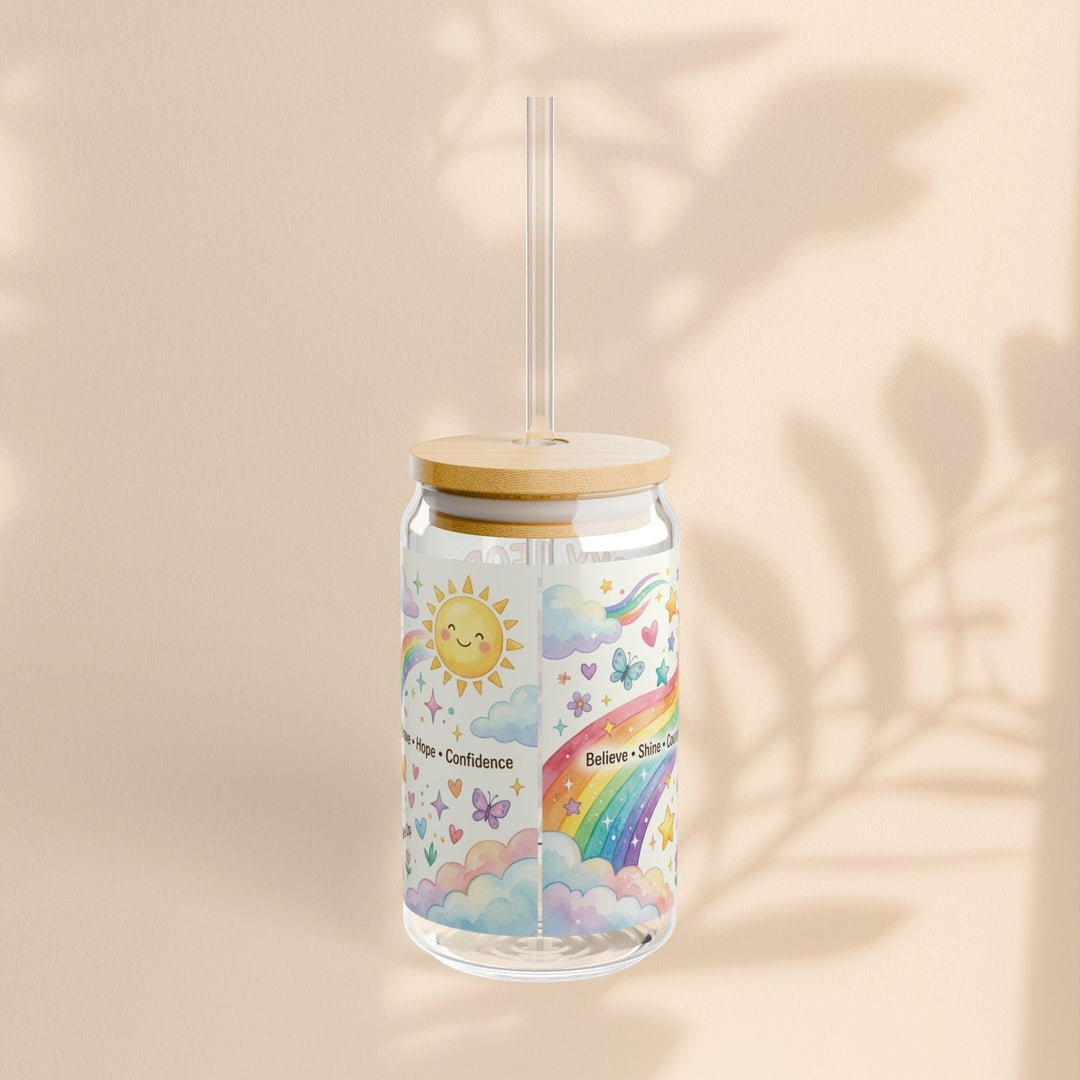 Sea Dragon Dreams 16oz clear glass sipper with bamboo lid, straw, and colorful rainbow, sun, and cloud illustration.