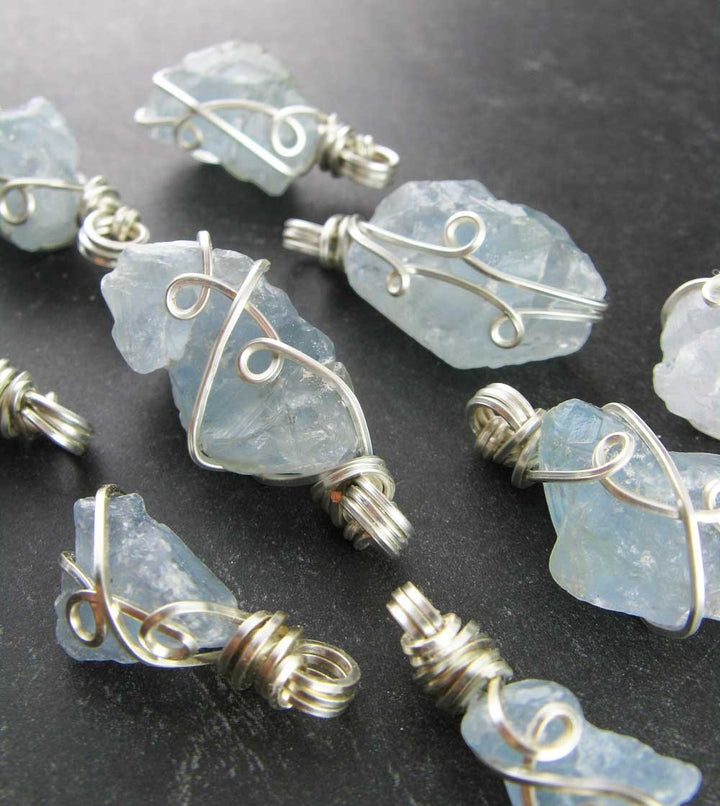 Sea Dragon Dreams handmade raw sky-blue celestite crystal pendants wrapped in elegant silver-plated copper wire.