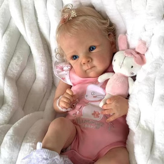 Sea Dragon Dreams 18-inch lifelike reborn baby doll in a pink bunny outfit holding a small plush rabbit toy