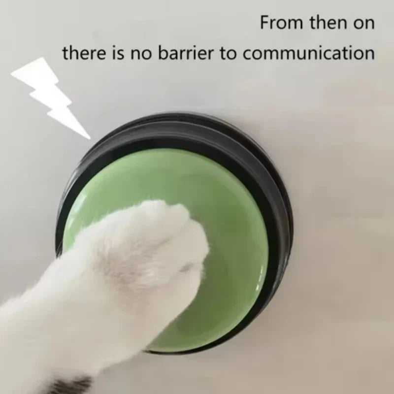 Sea Dragon Dreams recordable pet talking button in green being pressed by a cat paw for communication training