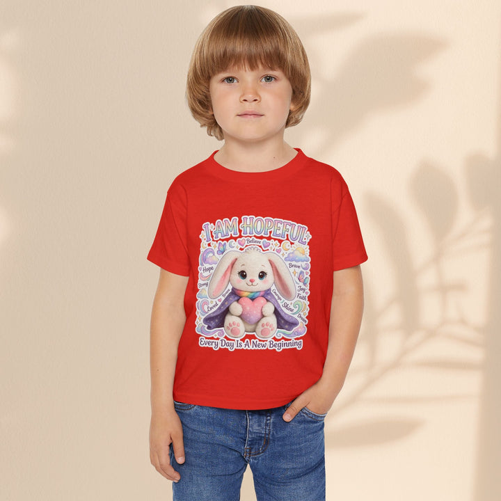 Sea Dragon Dreams toddler red cotton t-shirt with a cute bunny graphic and I Am Hopeful text on a young child.