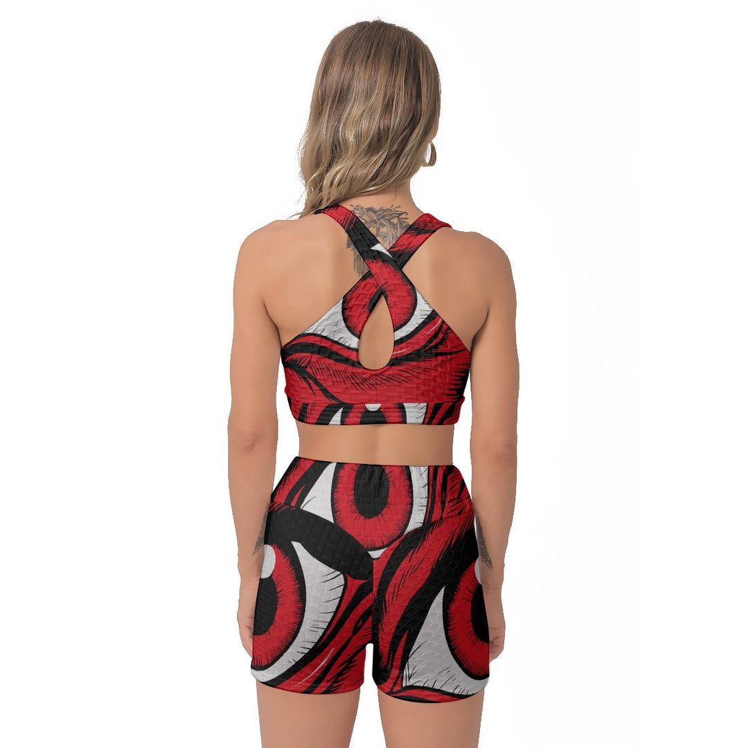 Sea Dragon Dreams women's sports bra and shorts set with a bold red eye print, featuring a cross-back design.