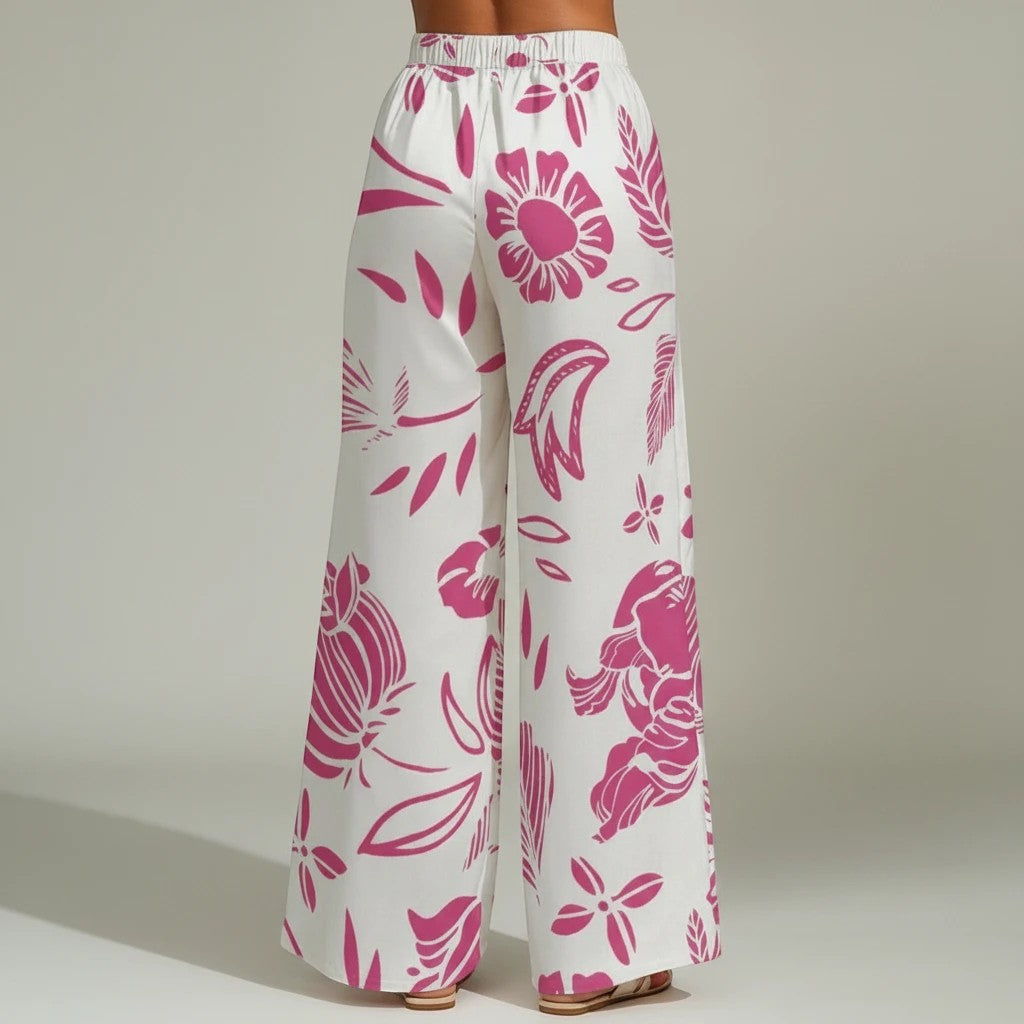 Sea Dragon Dreams wide-leg pants in white with a vibrant red floral print, featuring a relaxed, flowy fit.