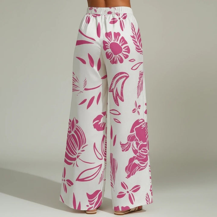 Sea Dragon Dreams wide-leg pants in white with a vibrant red floral print, featuring a relaxed, flowy fit.