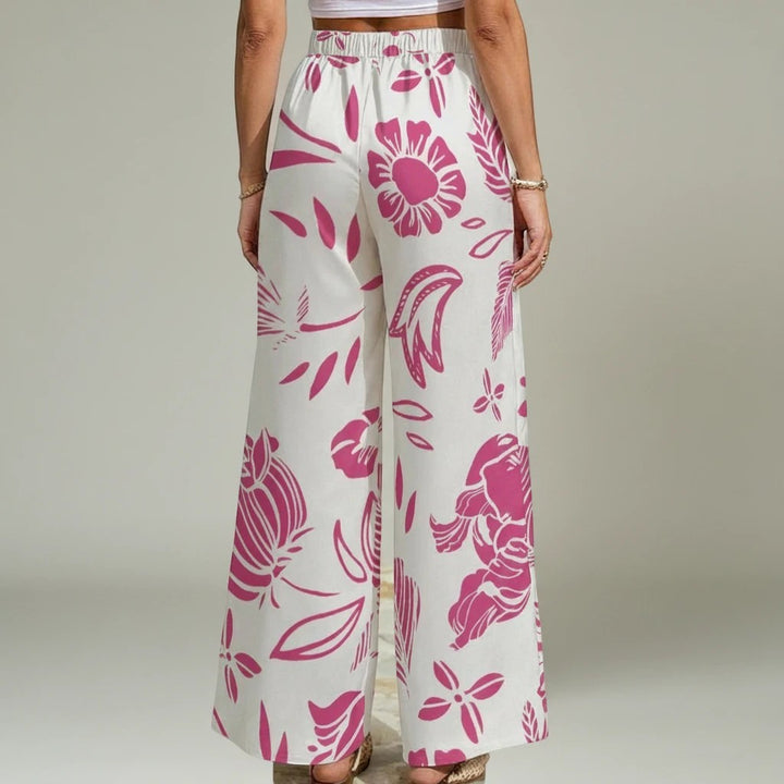 Sea Dragon Dreams women's wide-leg pants in white with a vibrant red floral print and convenient side pockets.