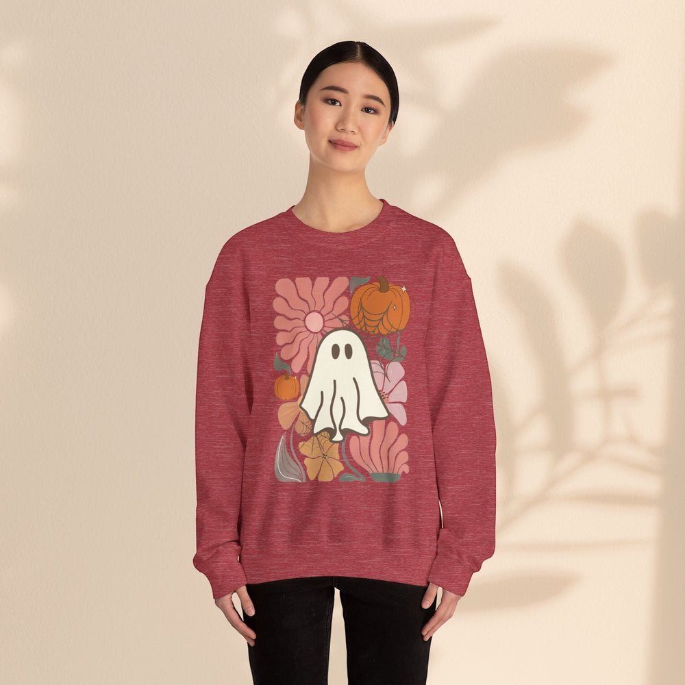 Sea Dragon Dreams unisex red crewneck sweatshirt with a retro ghost and floral pumpkin graphic print on a model.
