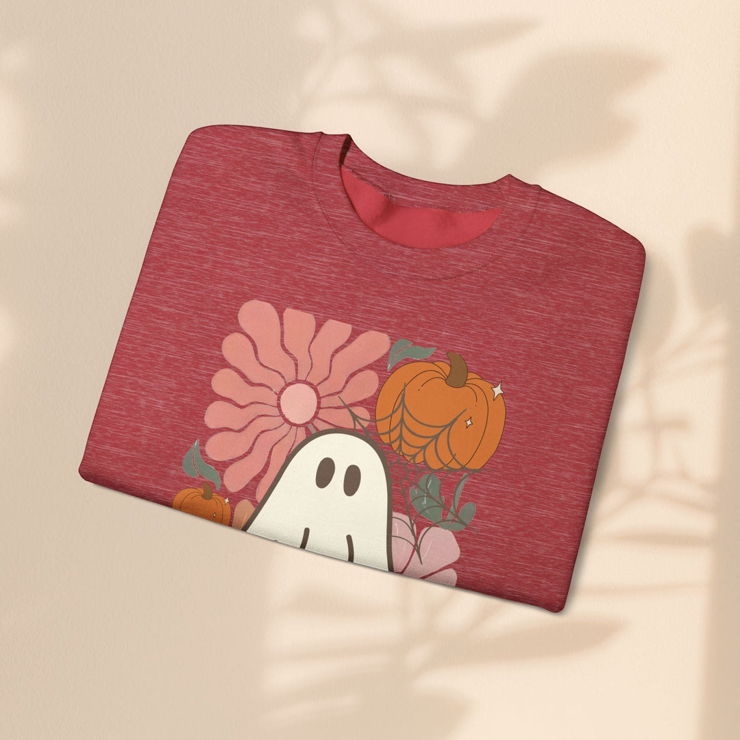 Sea Dragon Dreams red heather crewneck sweatshirt with a retro ghost, pumpkin, and flower graphic print
