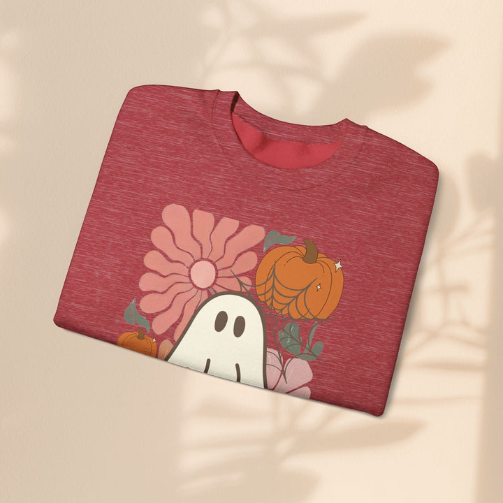 Sea Dragon Dreams red heather crewneck sweatshirt with a retro ghost, pumpkin, and flower graphic print