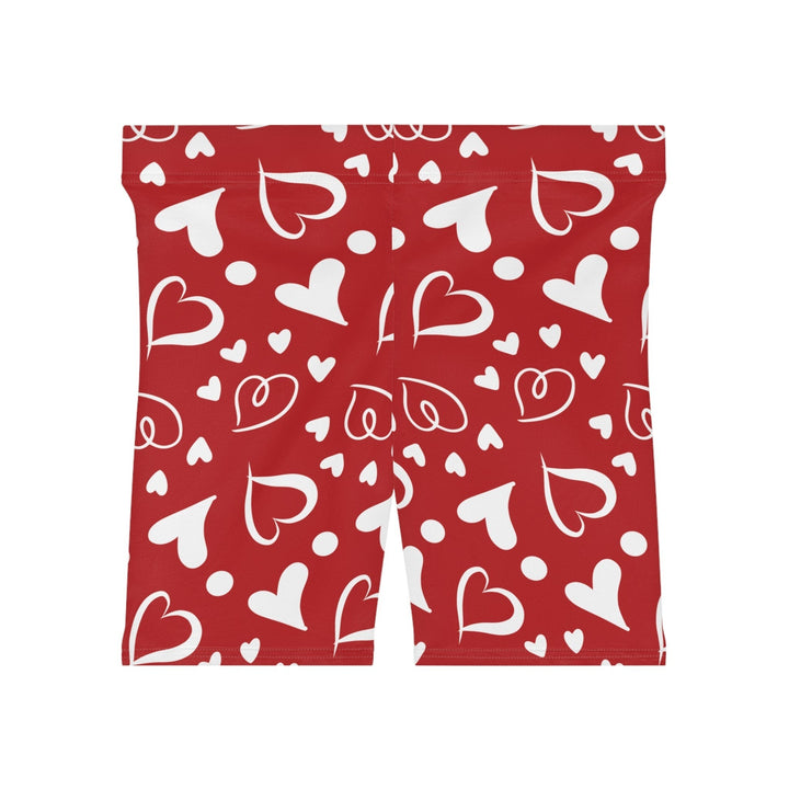 Sea Dragon Dreams high-waisted biker shorts in red with a white heart pattern, made from moisture-wicking fabric.