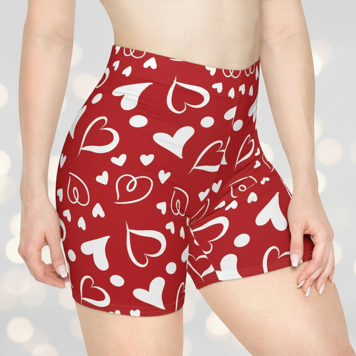 Sea Dragon Dreams high-waisted red biker shorts featuring a white heart pattern in moisture-wicking faux suede fabric.