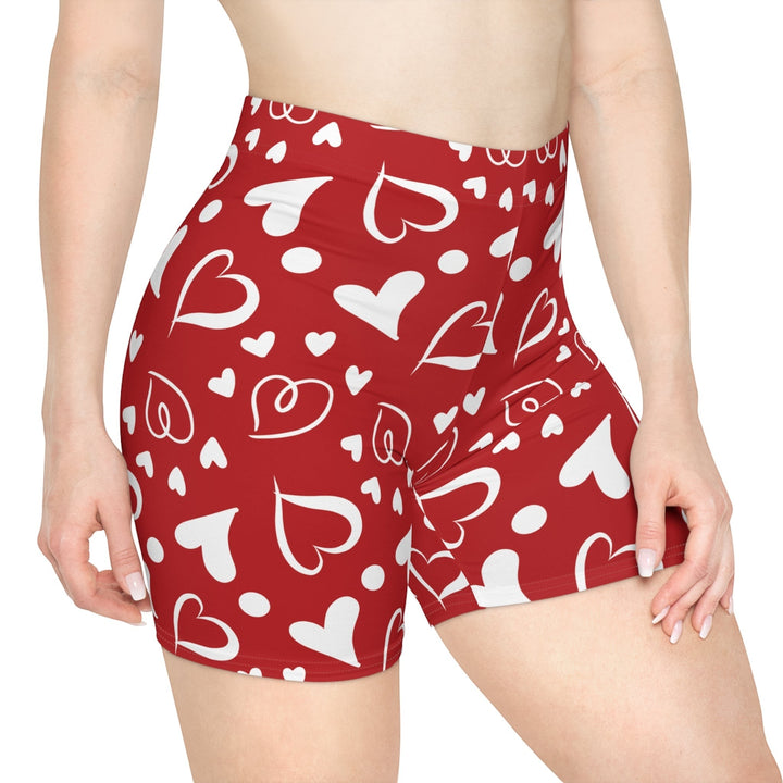 Sea Dragon Dreams high-waisted red biker shorts with a white heart pattern, made from moisture-wicking fabric.
