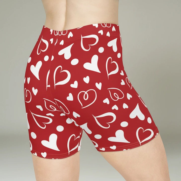 Sea Dragon Dreams high-waisted red biker shorts with a white heart pattern, featuring a moisture-wicking fabric.