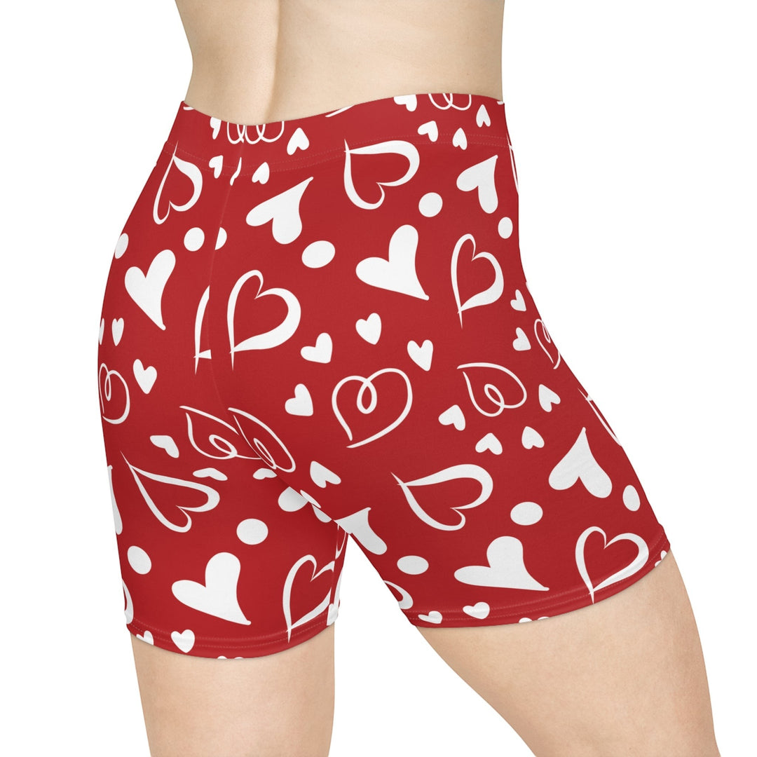 Sea Dragon Dreams high-waisted red biker shorts with a white heart pattern, featuring a stretchy faux suede finish.