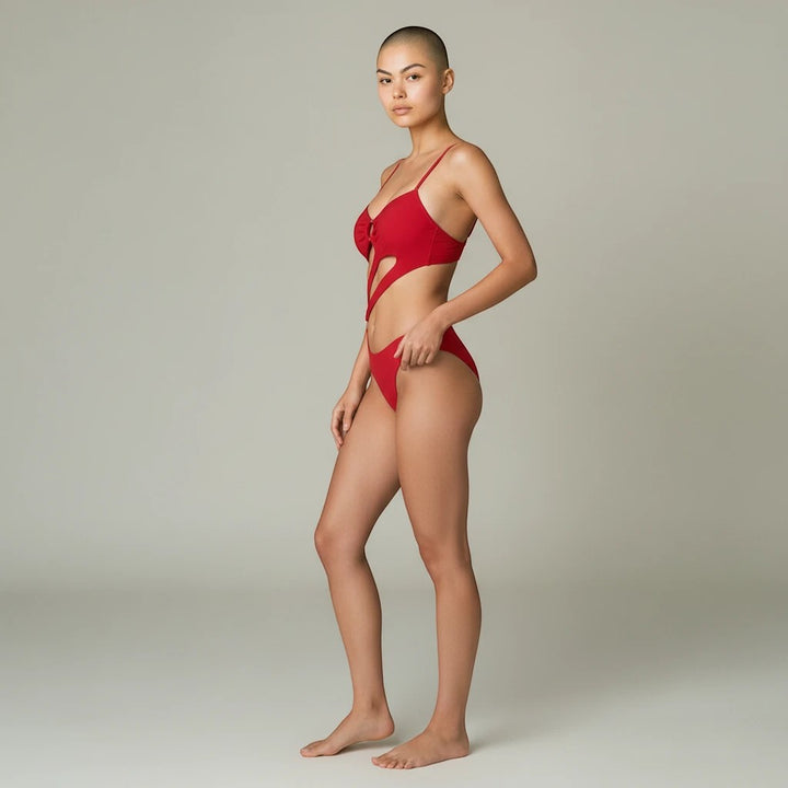 Sea Dragon Dreams red high-waist bikini with double straps worn by a model against a neutral studio background.