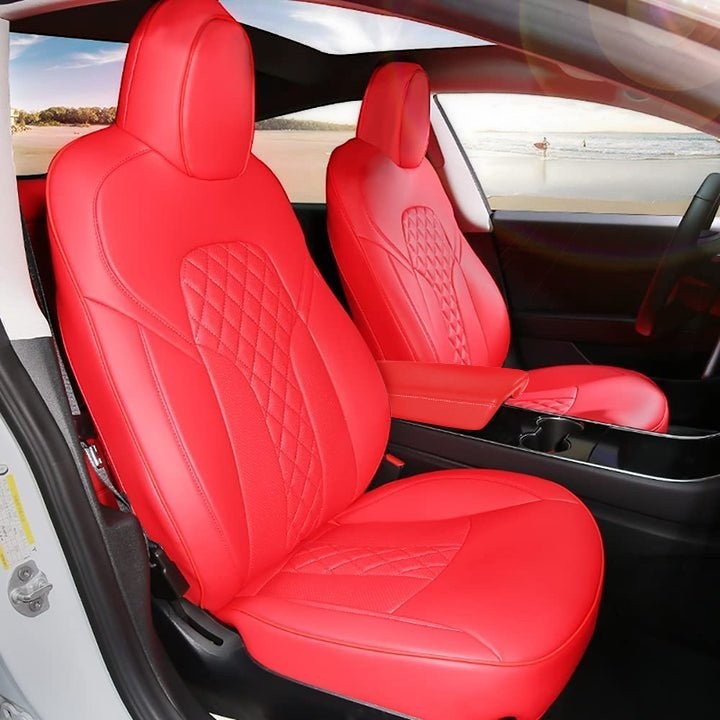 Sea Dragon Dreams bright red leather seat covers with diamond-stitched detailing installed in a Tesla interior.