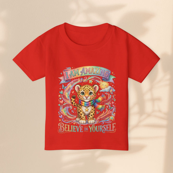 Sea Dragon Dreams red toddler cotton t-shirt featuring a cute leopard with a rainbow scarf and uplifting text.