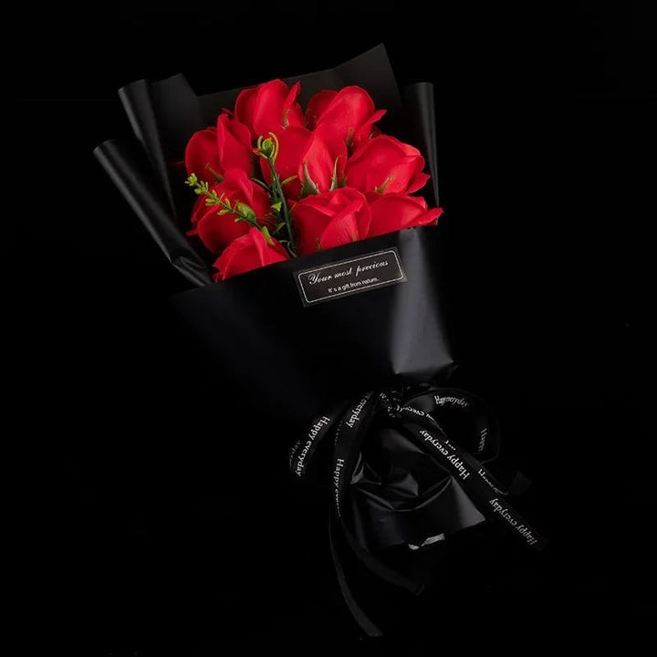 Sea Dragon Dreams bouquet of nine vibrant red artificial soap roses wrapped in elegant black paper with a ribbon
