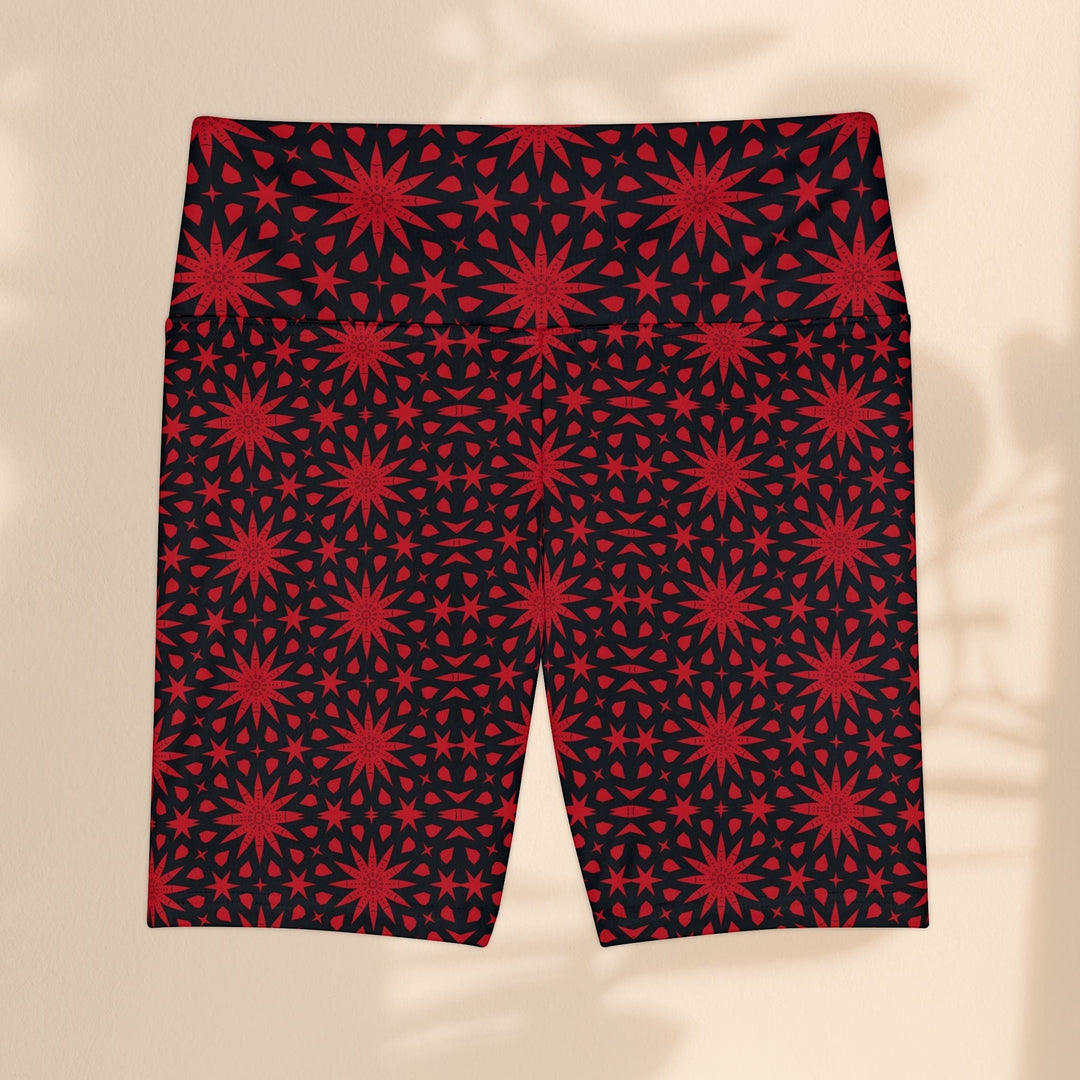 Sea Dragon Dreams red and black workout shorts featuring a repeating spiral star pattern in polyester fabric.