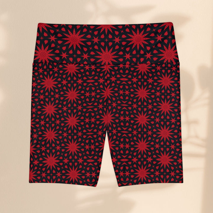 Sea Dragon Dreams red and black workout shorts featuring a repeating spiral star pattern in polyester fabric.