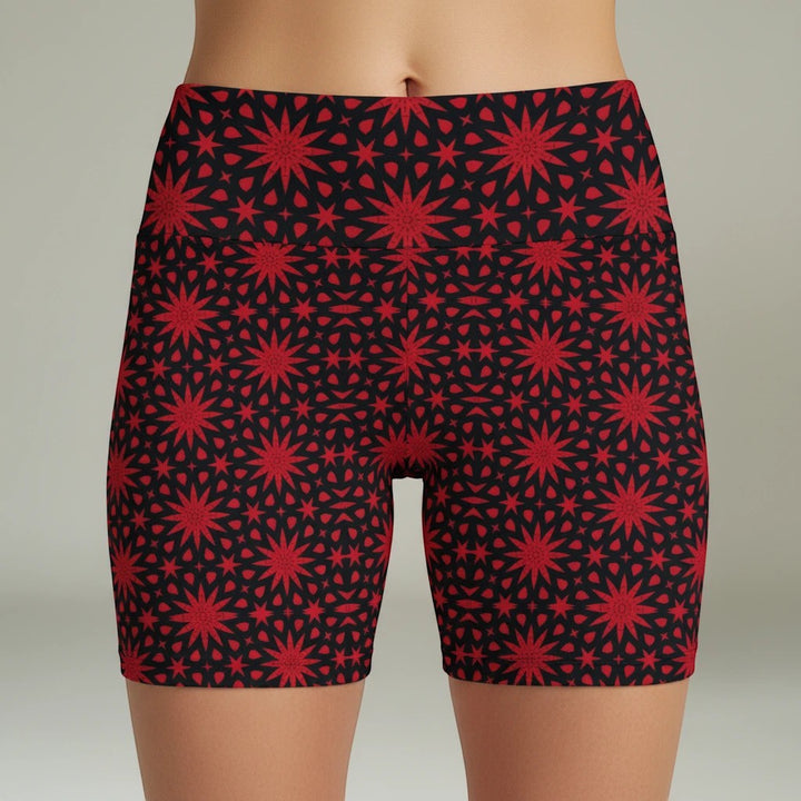 Sea Dragon Dreams red spiral star print workout shorts on a model, featuring a high-waist polyester athletic fit.