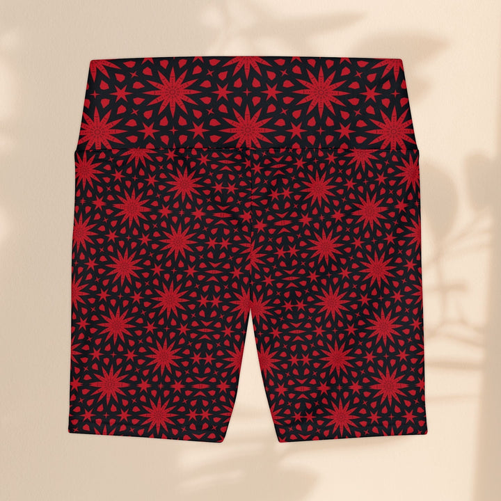 Sea Dragon Dreams red and black workout shorts featuring a repeating spiral star pattern in durable polyester fabric.