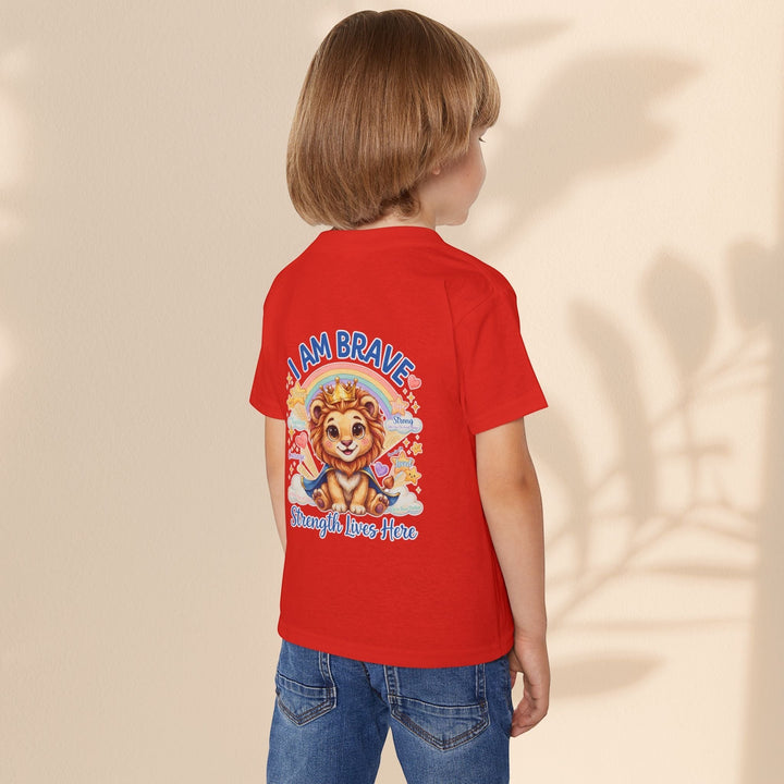 Sea Dragon Dreams toddler wearing a red cotton t-shirt with a Leo Lion graphic and I Am Brave text on the back
