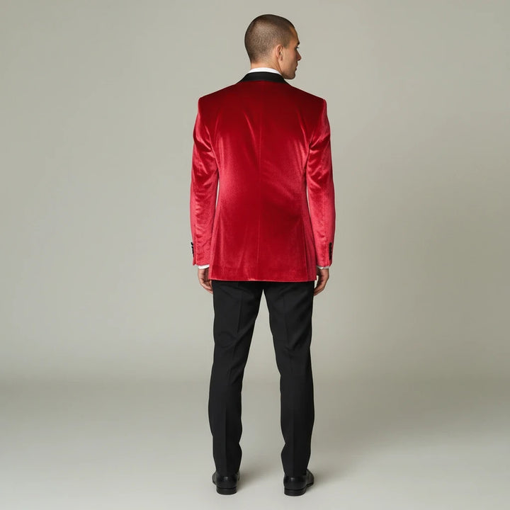 Back view of a man wearing a Wessi red velvet tuxedo blazer with black peak lapels and black trousers by Sea Dragon Dreams