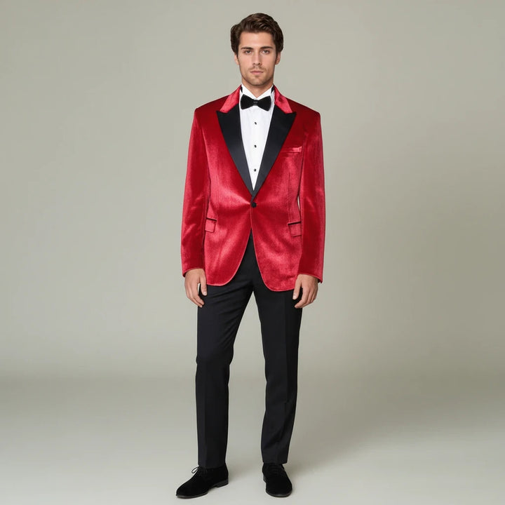 Sea Dragon Dreams Wessi red velvet tuxedo blazer with black peak lapels worn by a man with a black bow tie and trousers.