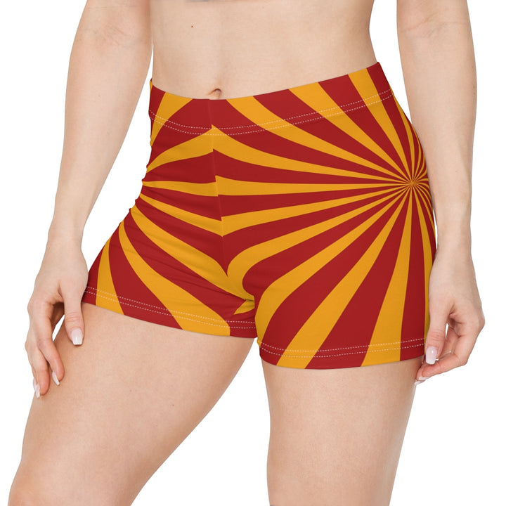 Sea Dragon Dreams women's skinny fit shorts in a vibrant red and yellow sunburst pattern with a faux suede finish.