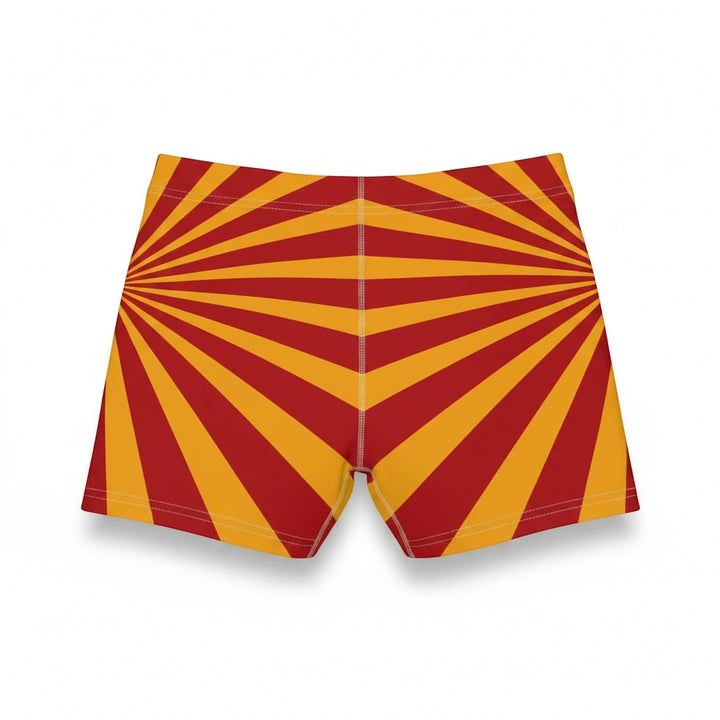 Sea Dragon Dreams women's skinny fit shorts in a vibrant red and yellow sunburst pattern with a faux suede finish.