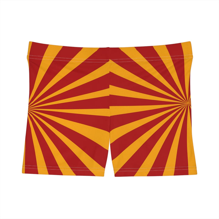 Sea Dragon Dreams women's skinny fit shorts in a vibrant red and yellow sunburst pattern with a stretchy waistband.