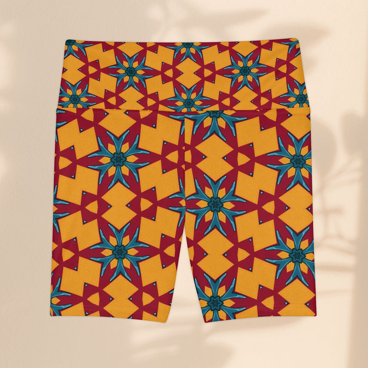 Sea Dragon Dreams women's workout shorts in a vibrant red and yellow geometric star pattern, made of breathable polyester.