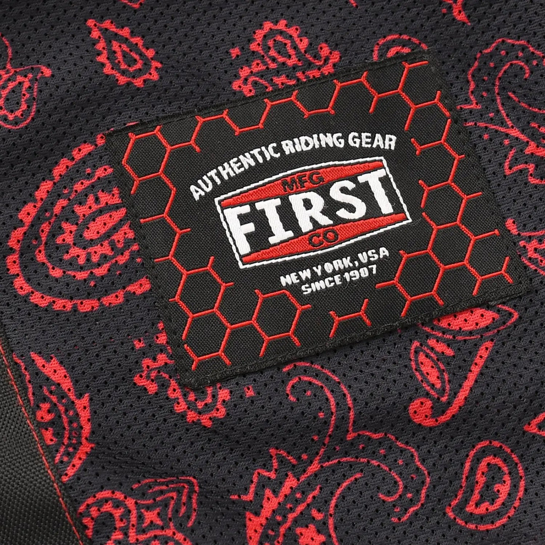 Sea Dragon Dreams Redstrike motorcycle jacket interior featuring a black mesh lining with a red paisley print pattern.