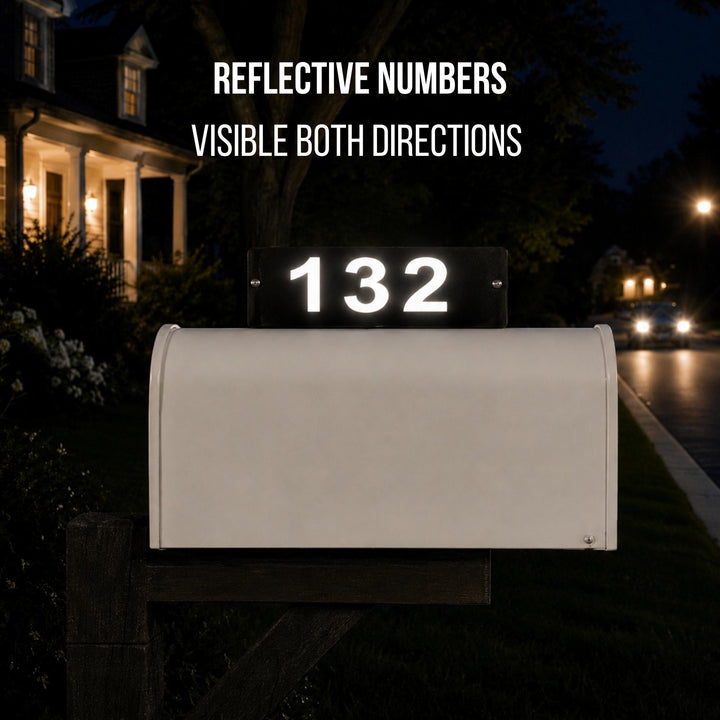 Sea Dragon Dreams personalized mailbox topper with reflective house numbers glowing at night on a rural mailbox