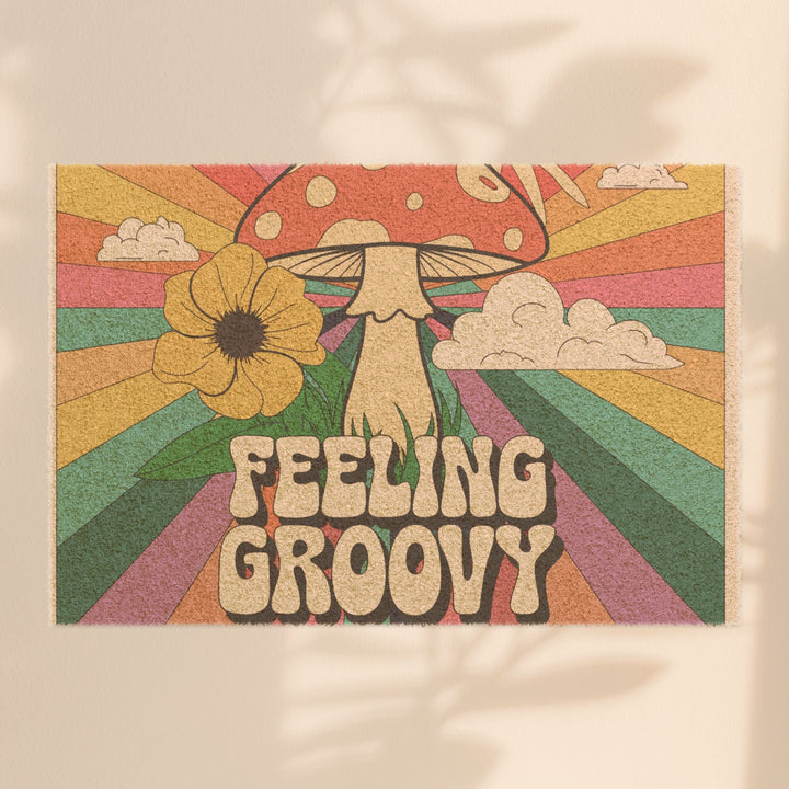 Sea Dragon Dreams Feeling Groovy door mat with retro mushroom, flower, and rainbow ray design on natural coir fiber.