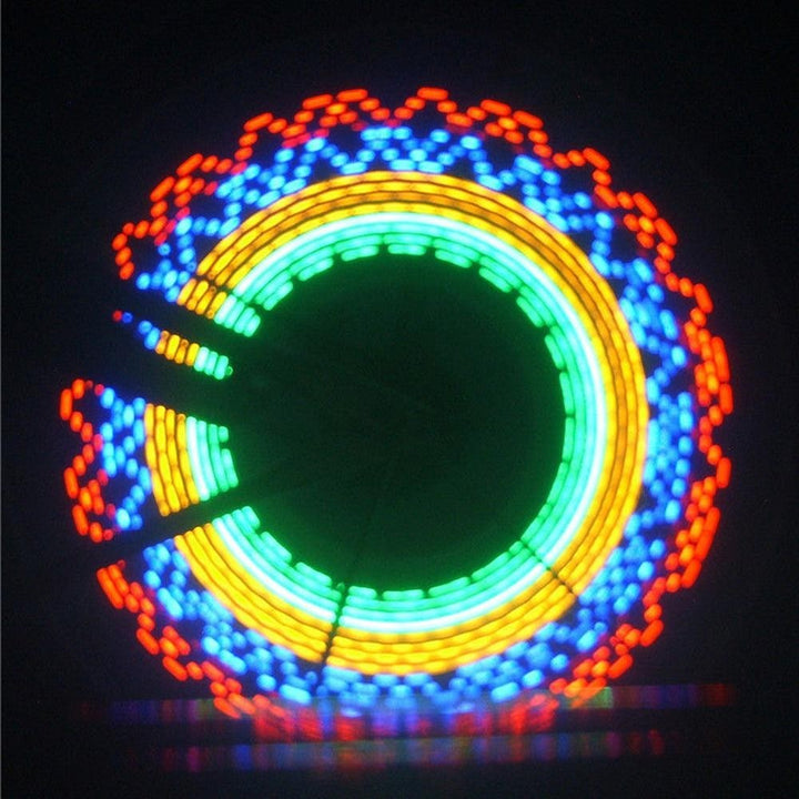 Sea Dragon Dreams RGB LED bike wheel lights creating colorful animated patterns on a spinning bicycle wheel at night.