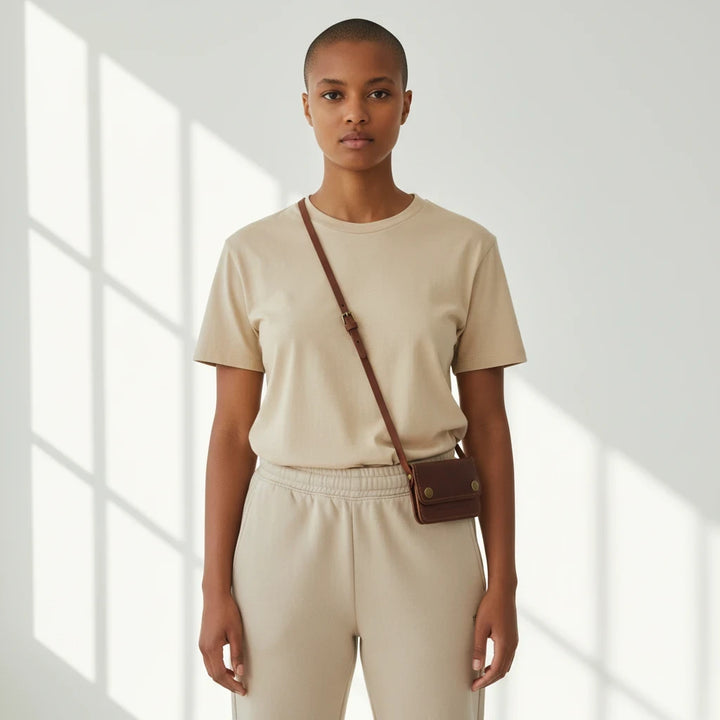 Sea Dragon Dreams Rogue full-grain leather belt wallet worn crossbody by a model in a beige outfit