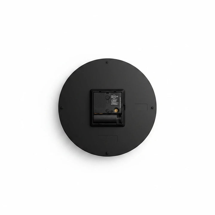 Back view of a Sea Dragon Dreams round acrylic wall clock showing the black casing, battery compartment, and keyhole.