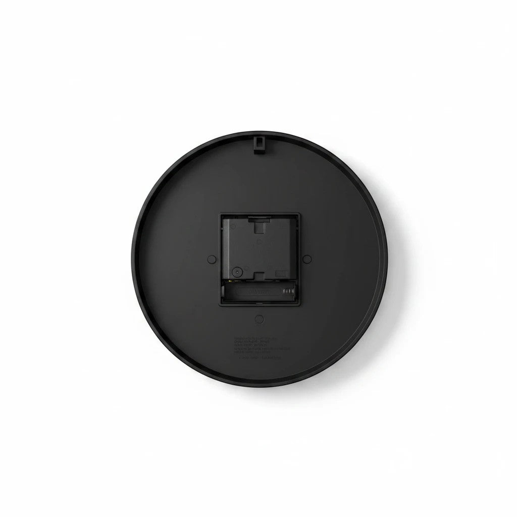 Sea Dragon Dreams round acrylic wall clock back view showing the black casing, battery compartment, and hanging slot.