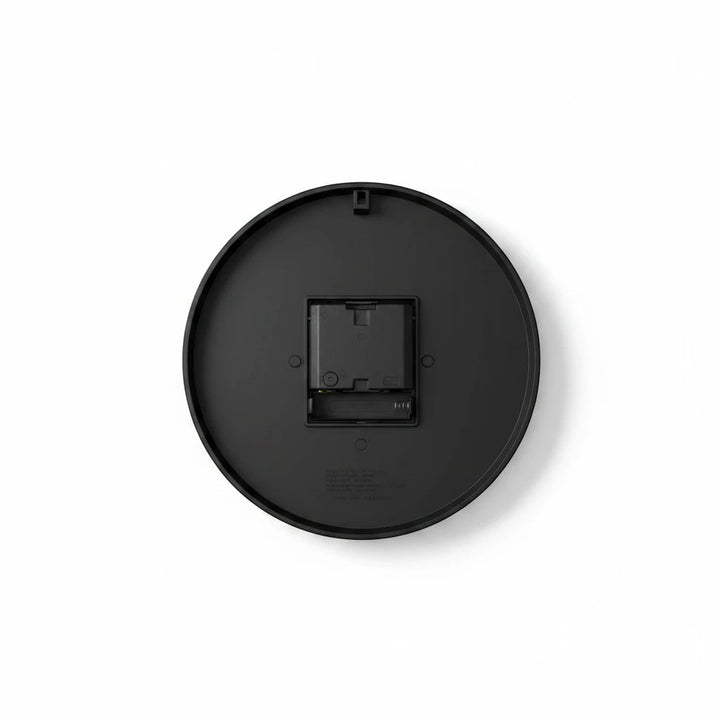 Sea Dragon Dreams round acrylic wall clock back view showing the black casing, battery compartment, and hanging slot.
