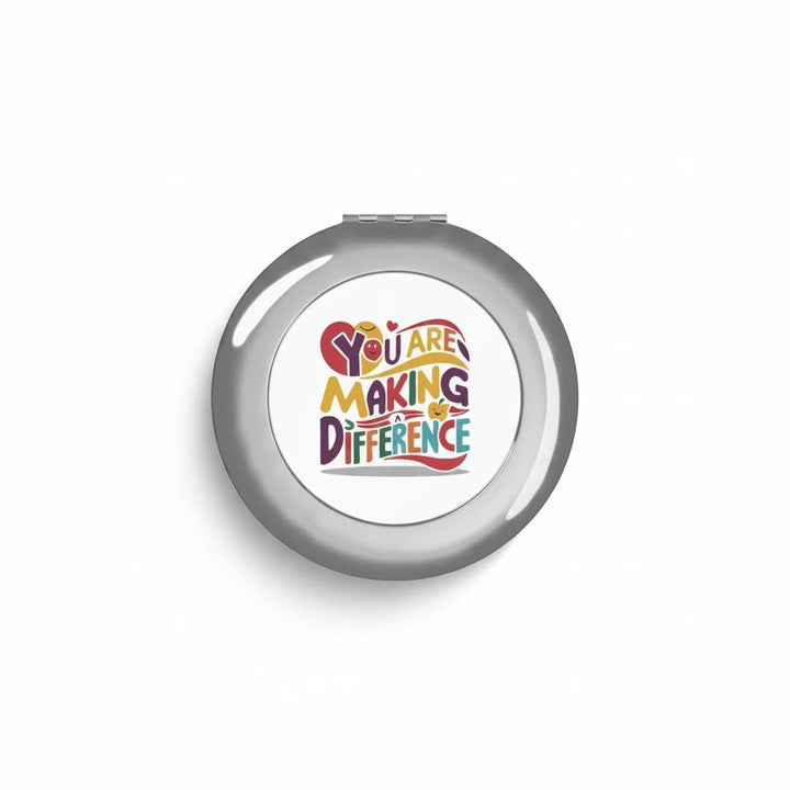Sea Dragon Dreams round metal compact travel mirror with You Are Making a Difference text design on white insert